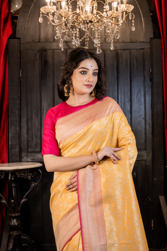 Mango Yellow Matka Silk with all over Zari work and Coral Pink border