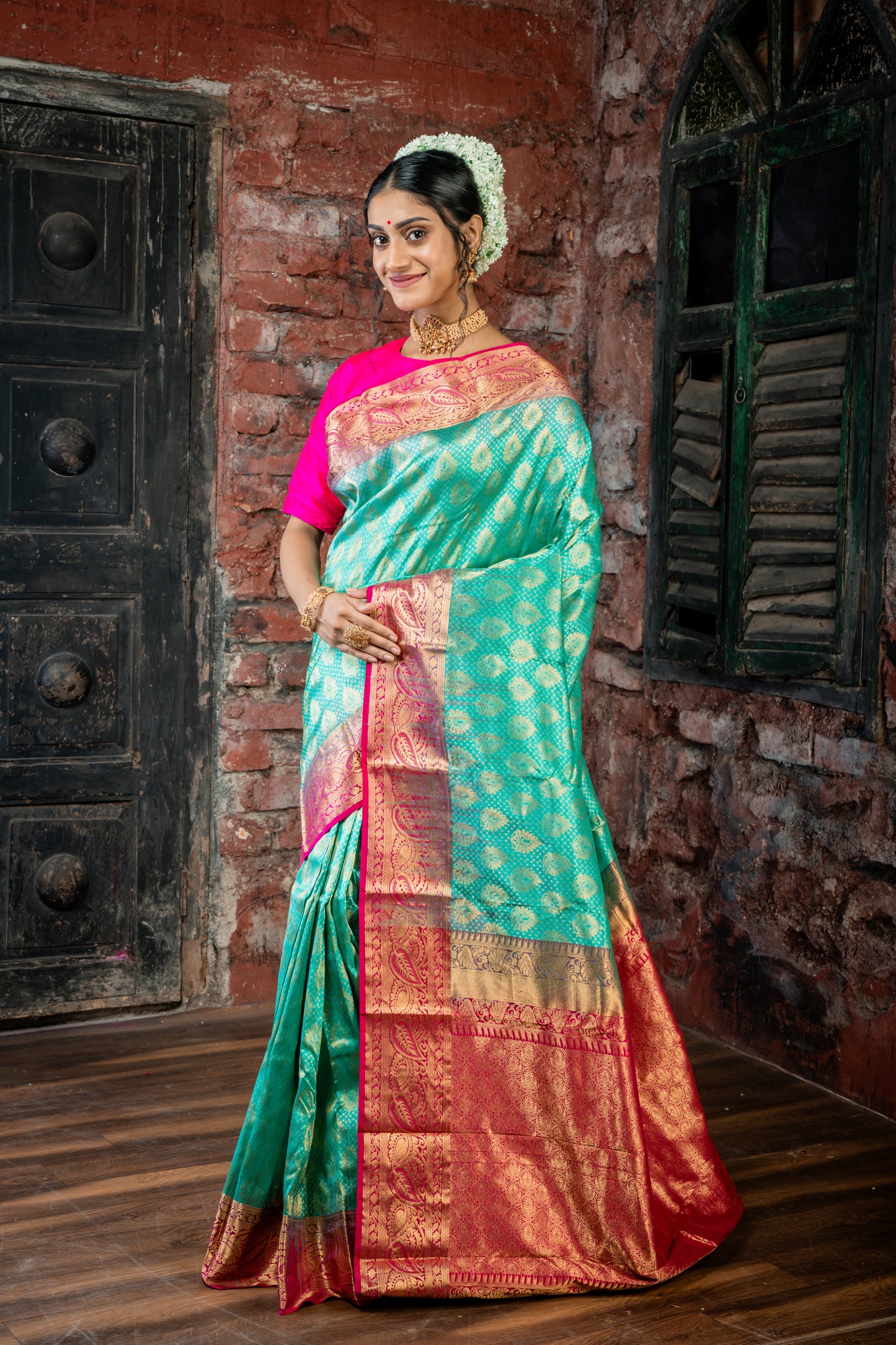 Dark Sea Green Kanchipuram Silk with All Over 'Sanvi Brocade' work and Hot Pink Border