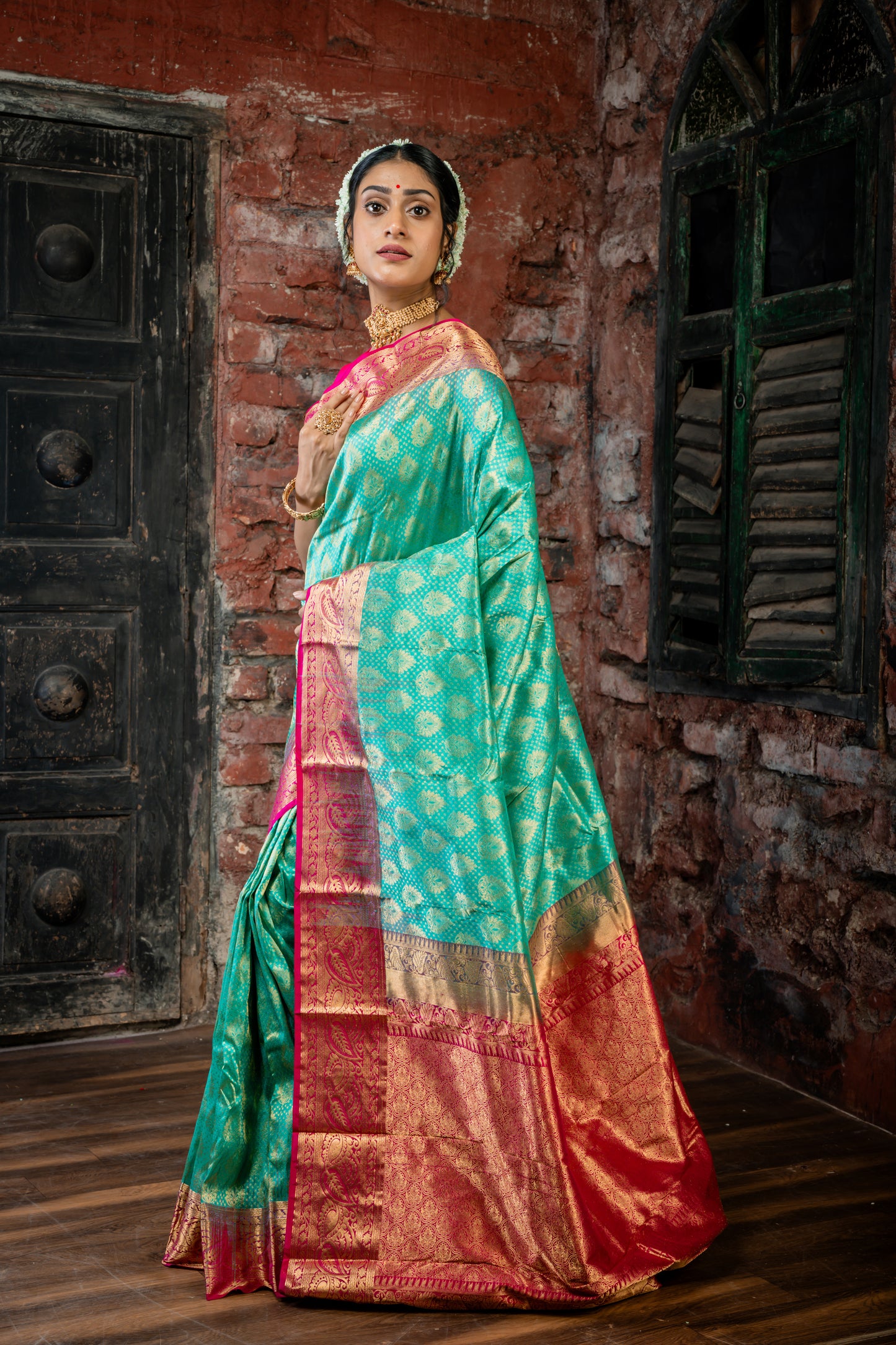 Dark Sea Green Kanchipuram Silk with All Over 'Sanvi Brocade' work and Hot Pink Border