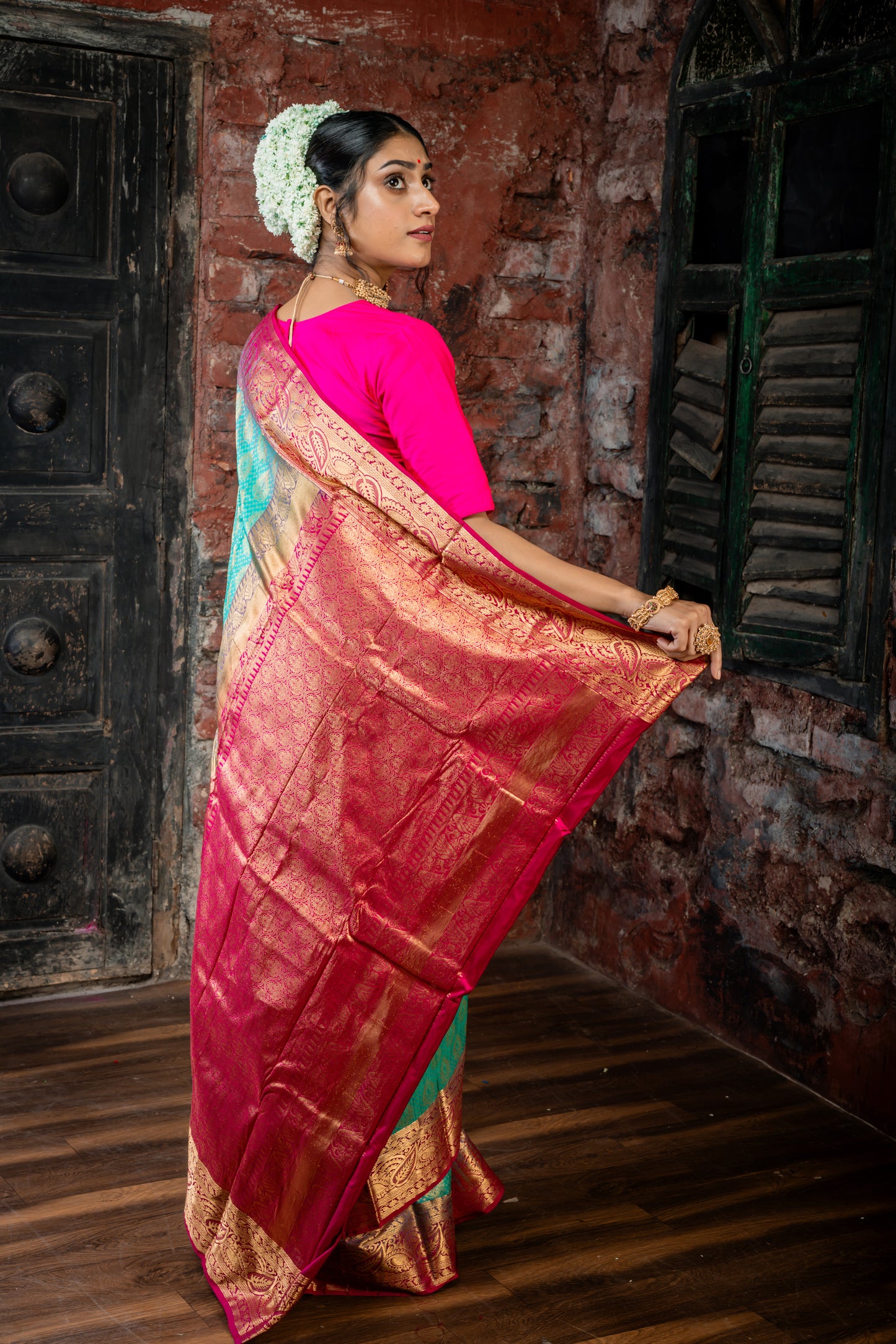 Dark Sea Green Kanchipuram Silk with All Over 'Sanvi Brocade' work and Hot Pink Border