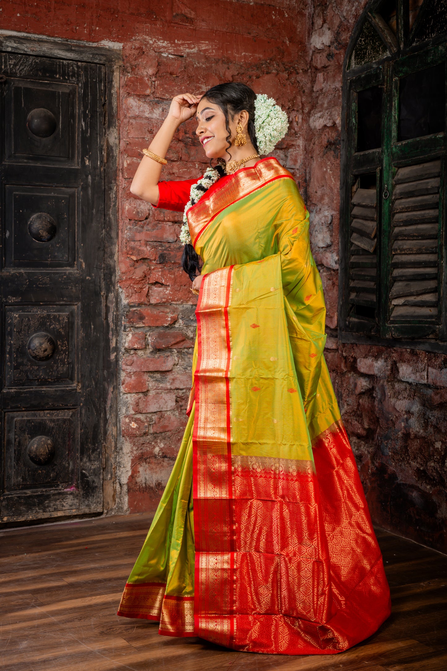 Parrot Green and Gold Dual Tone Kanjeevaram with Traditional Buti, Red Gatti Border and Pallu