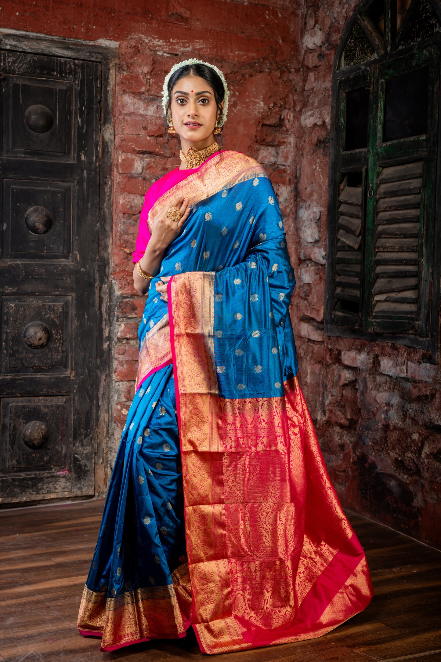 Peacock Blue Kanchipuram Silk with Traditional Zari Peacock Motif Buti and Hot Pink Border