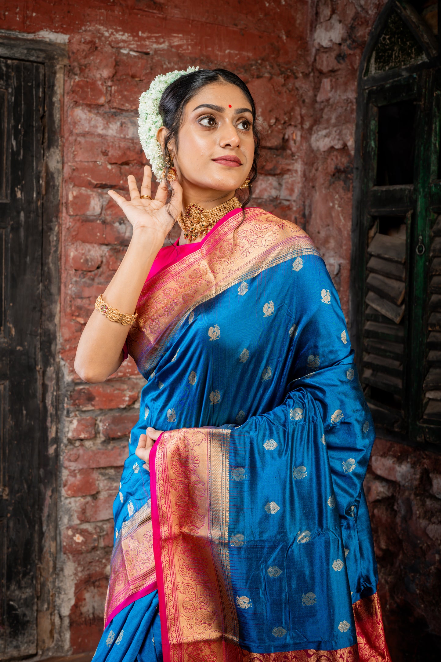 Peacock Blue Kanchipuram Silk with Traditional Zari Peacock Motif Buti and Hot Pink Border