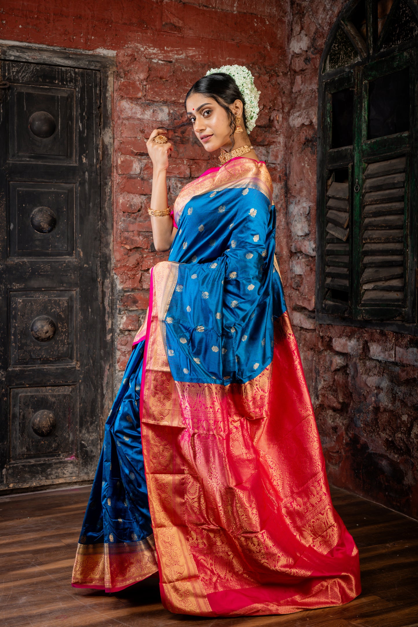 Peacock Blue Kanchipuram Silk with Traditional Zari Peacock Motif Buti and Hot Pink Border