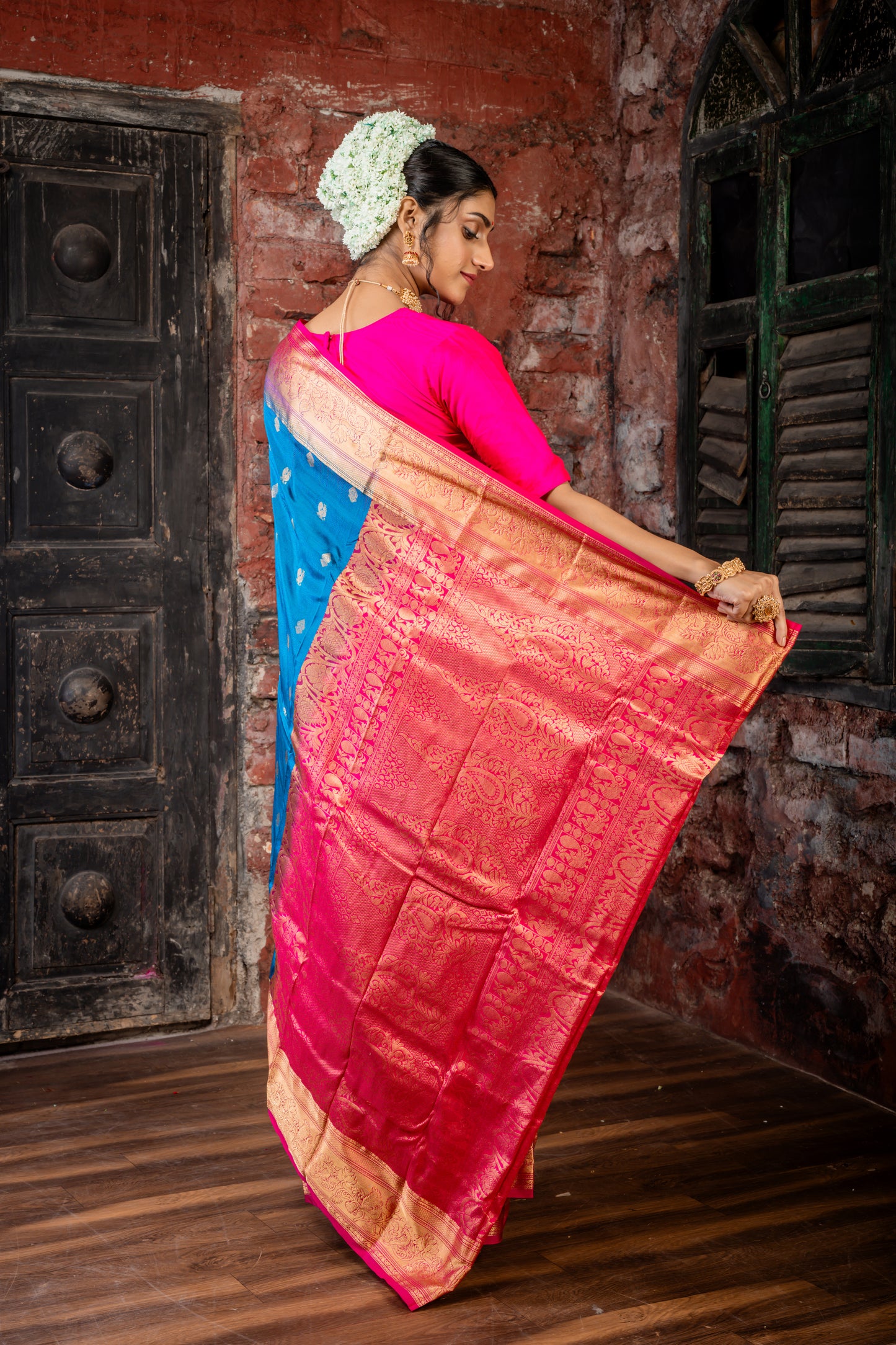 Peacock Blue Kanchipuram Silk with Traditional Zari Peacock Motif Buti and Hot Pink Border